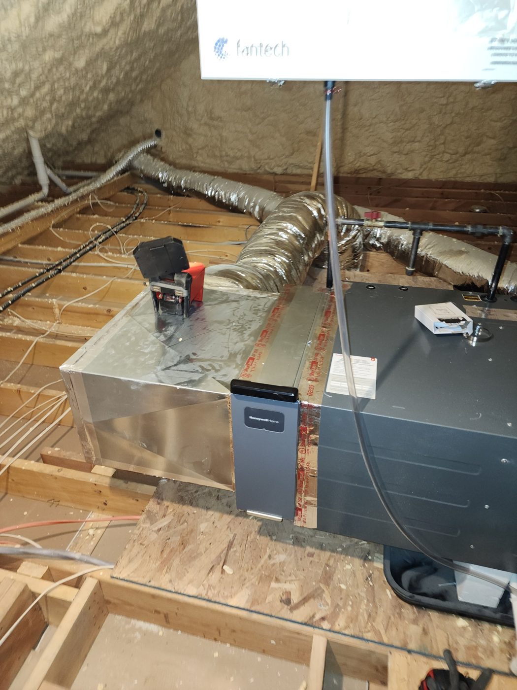 Honeywell Home media air cleaner cabinet installed at the return of an attic air handler